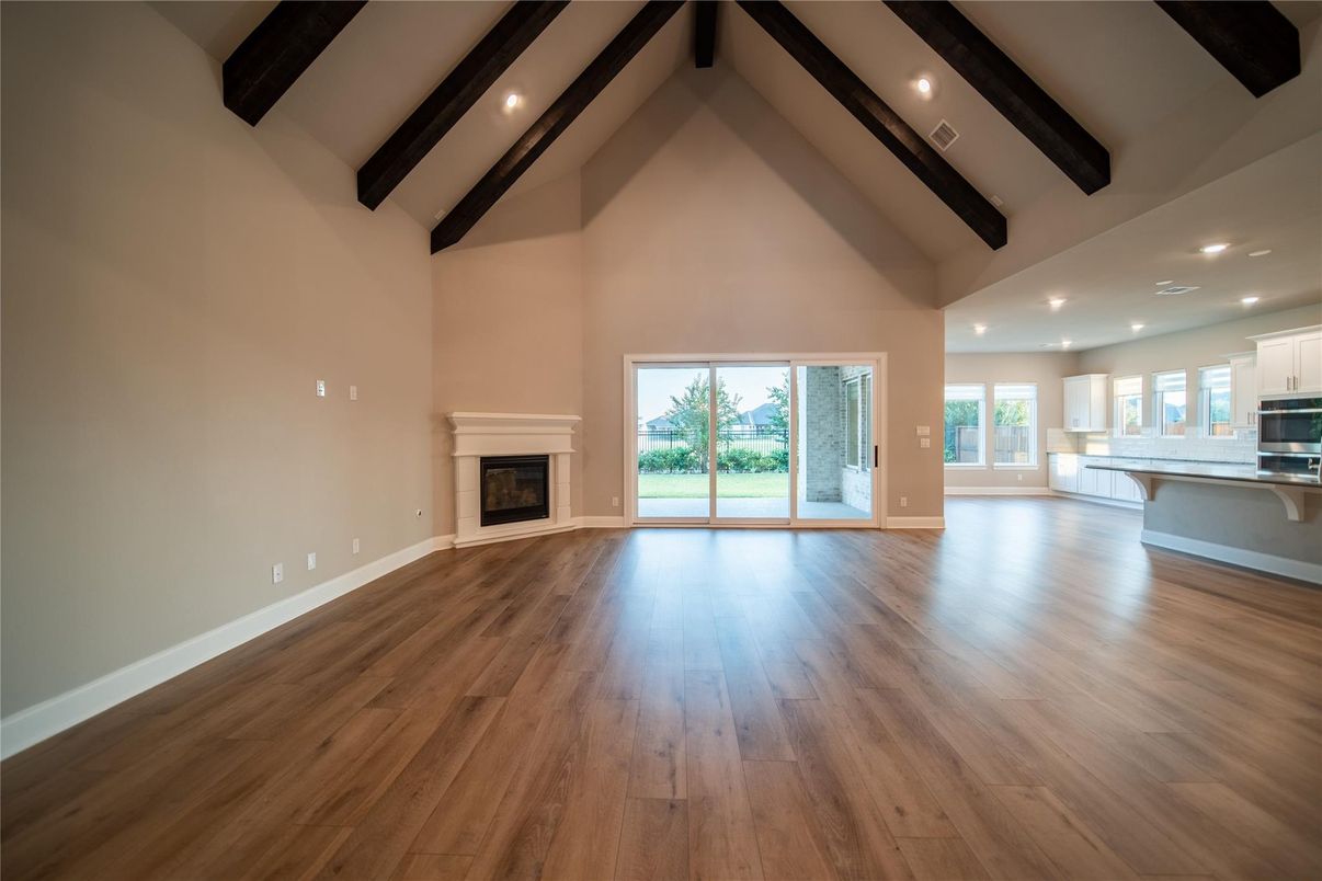 Empty room, Fireplace, Interior, Kitchen, Recessed Lighting, Wooden Beams, Wood Texture Flooring