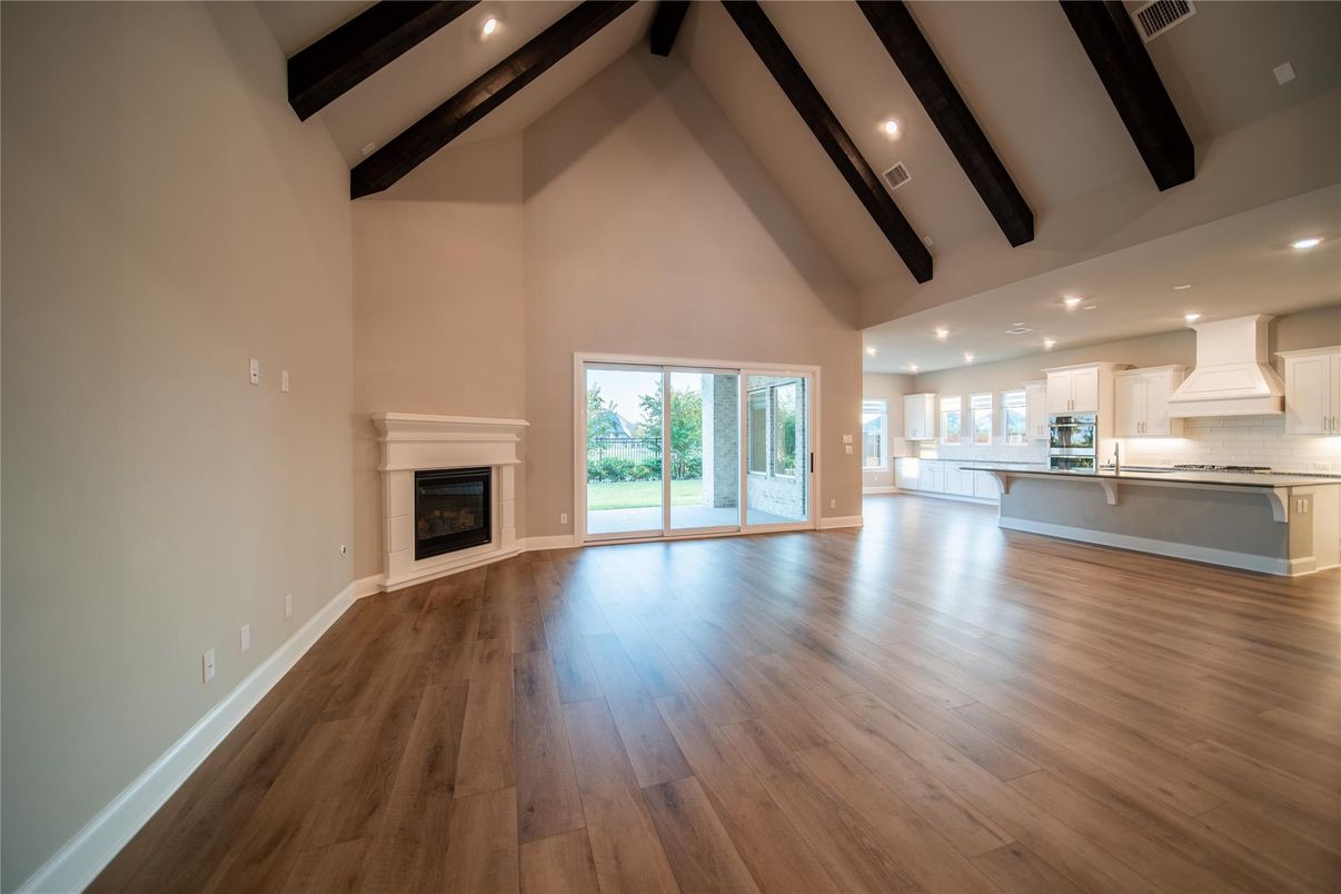 Empty room, Fireplace, Interior, Recessed Lighting, Wooden Beams, Wood Texture Flooring