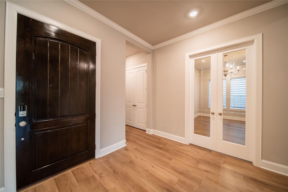 Empty room, Fireplace, Interior, Kitchen, Recessed Lighting, Stainless Steel Appliances, Wooden Beams, Wood Texture Flooring