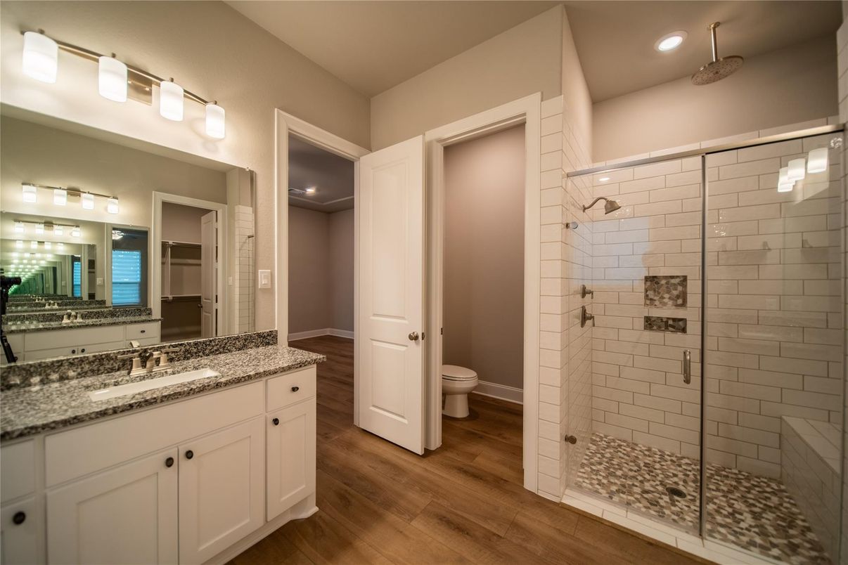 Bathroom, Dual Sink Vanities, Glass Shower, Interior, Recessed Lighting, Wood Texture Flooring