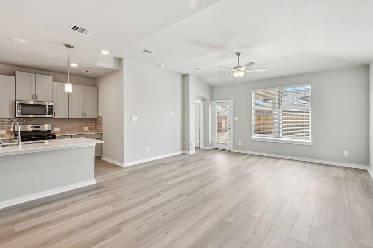 Empty room, Interior, Kitchen, Pendant Lights, Recessed Lighting, Stainless Steel Appliances, Wood Texture Flooring