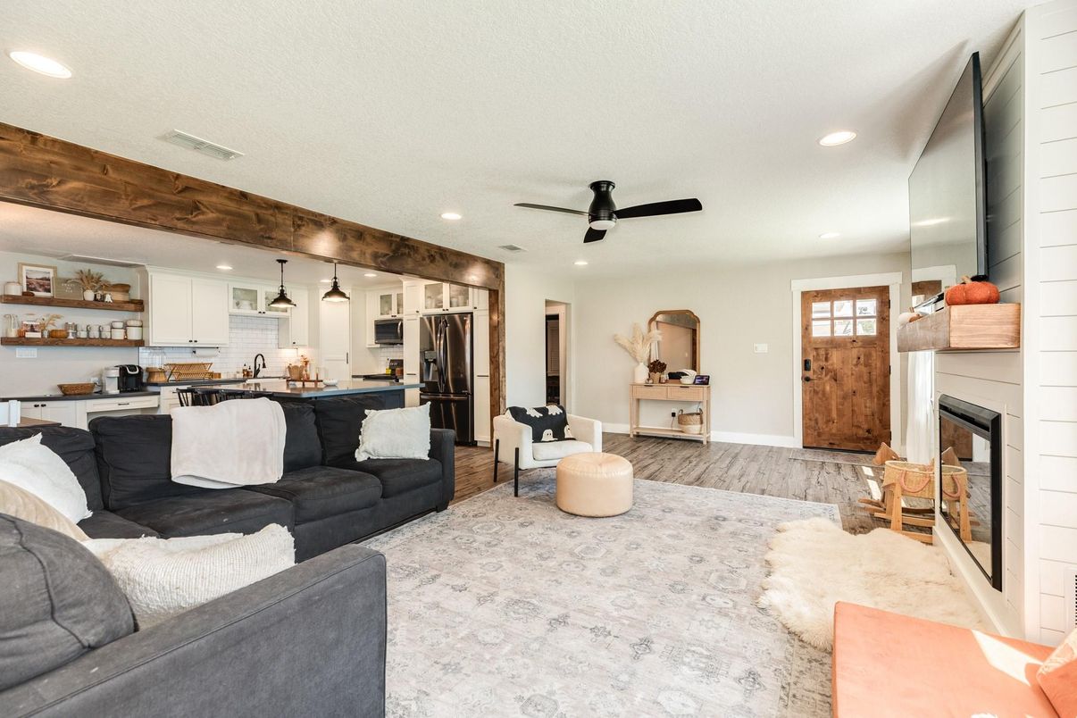 Fireplace, Interior, Kitchen, Living room, Pendant Lights, Recessed Lighting, Stainless Steel Appliances, Wood Texture Flooring