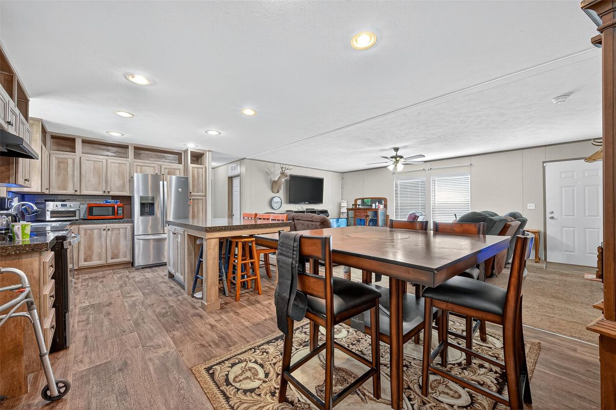 Dining room, Interior, Kitchen, Recessed Lighting, Stainless Steel Appliances, Wood Texture Flooring