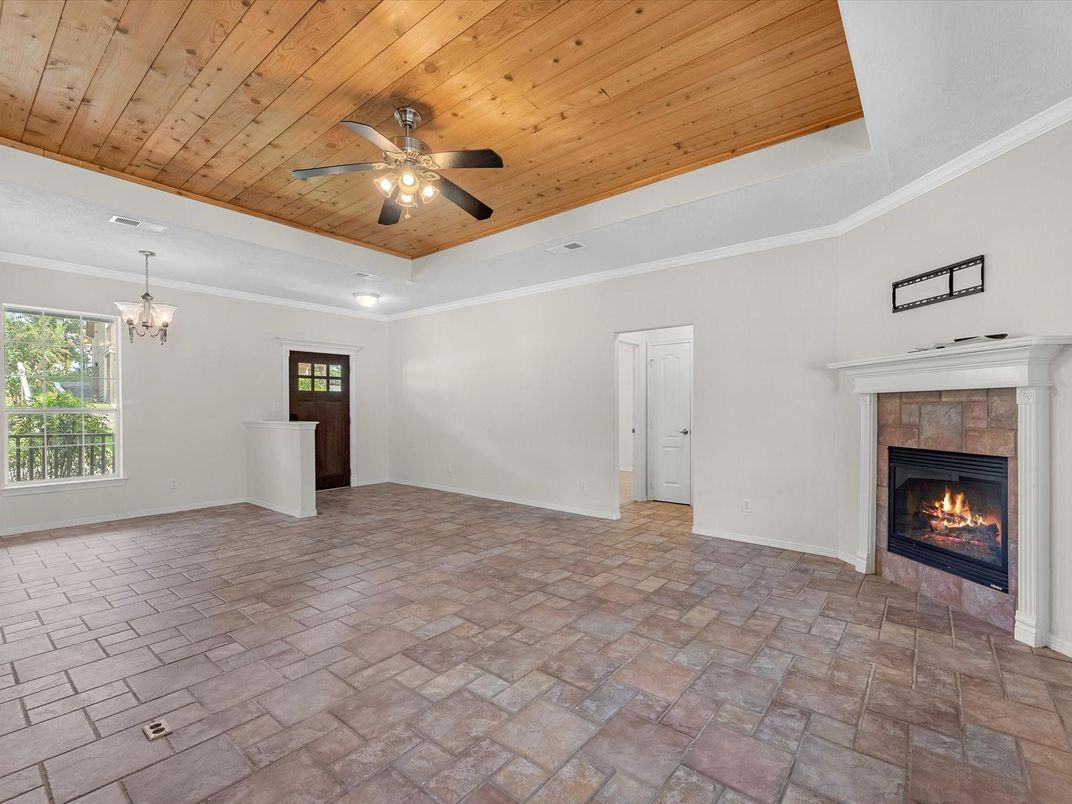Chandelier, Empty room, Fireplace, Interior, Recessed Lighting, Wooden Ceilings