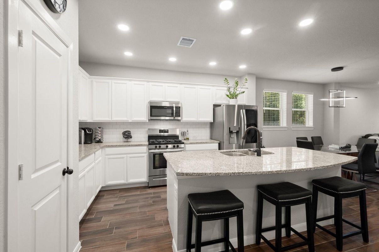 Dining room, Interior, Kitchen, Pendant Lights, Recessed Lighting, Stainless Steel Appliances, Wood Texture Flooring