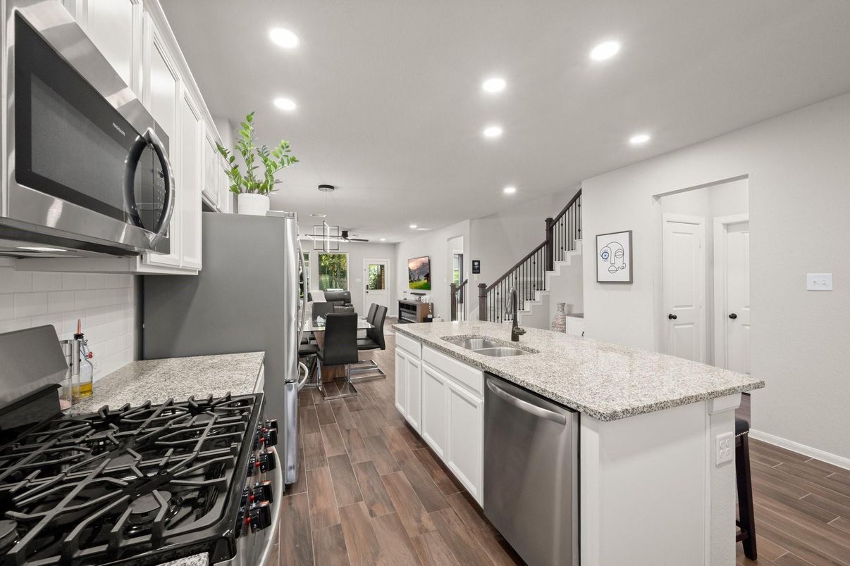 Dining room, Interior, Kitchen, Pendant Lights, Recessed Lighting, Stainless Steel Appliances, Wood Texture Flooring