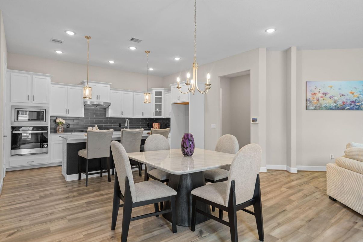 Chandelier, Dining room, Interior, Kitchen, Pendant Lights, Recessed Lighting, Stainless Steel Appliances, Wood Texture Flooring