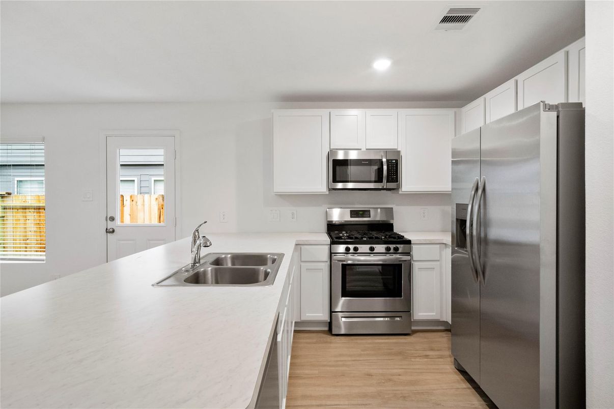 Interior, Kitchen, Recessed Lighting, Stainless Steel Appliances, Wood Texture Flooring