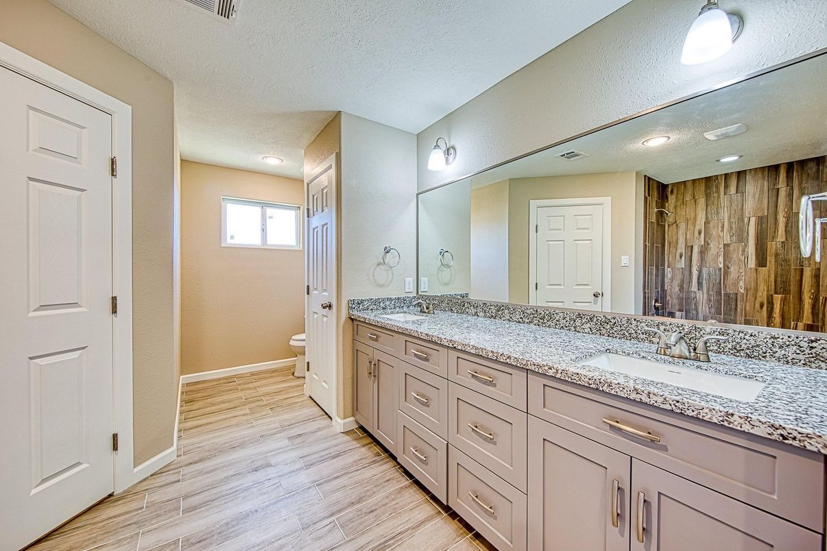 Bathroom, Dual Sink Vanities, Interior, Recessed Lighting, Wood Texture Flooring