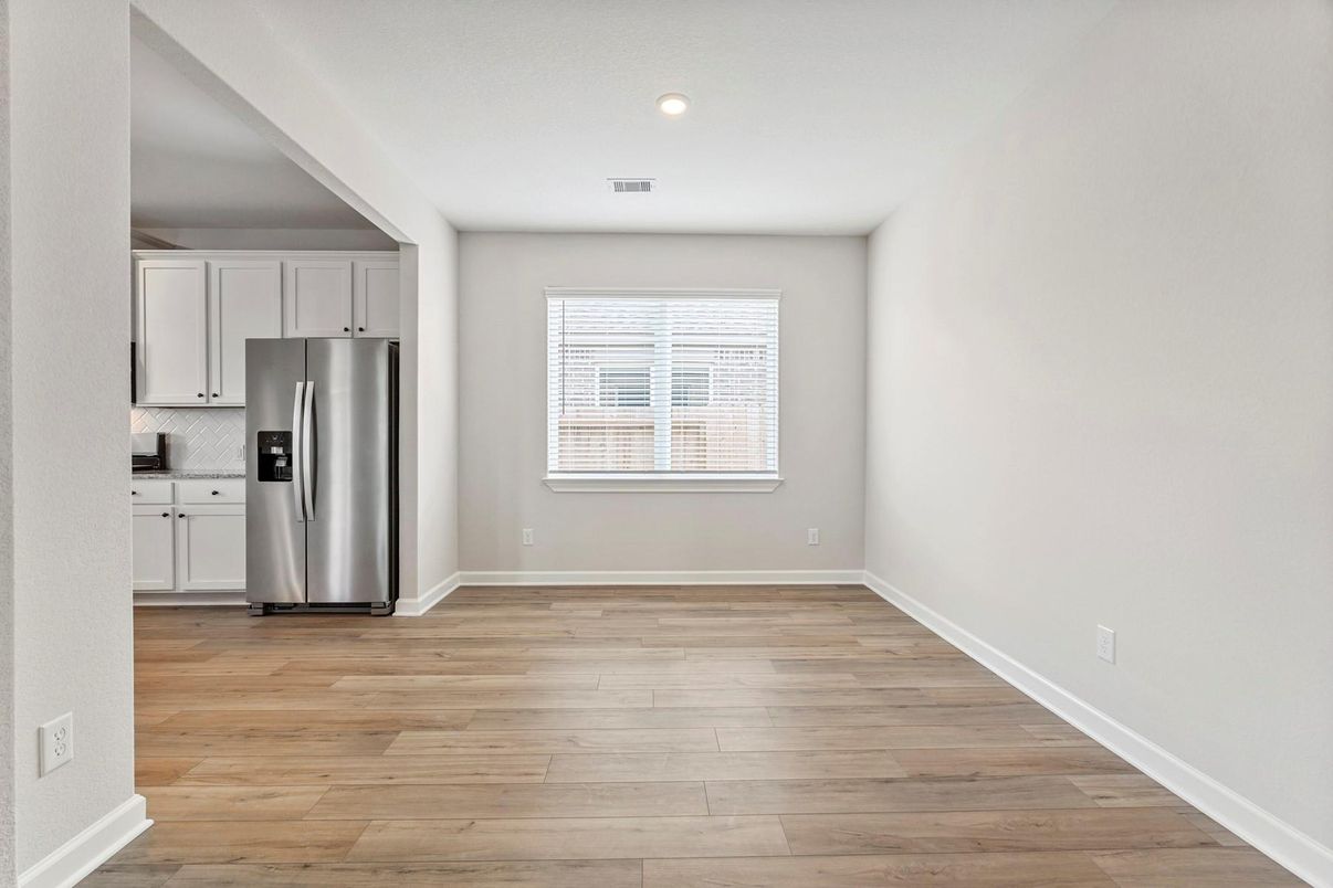 Empty room, Interior, Kitchen, Recessed Lighting, Stainless Steel Appliances, Wood Texture Flooring