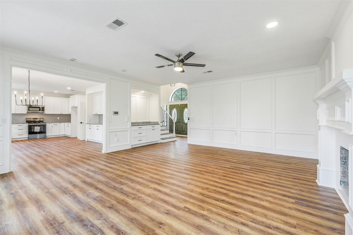 Empty room, Fireplace, Interior, Kitchen, Pendant Lights, Recessed Lighting, Wood Texture Flooring