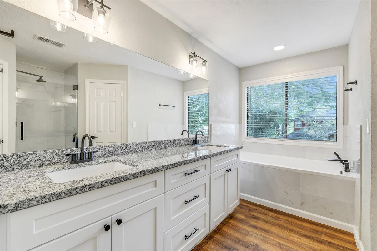 Bathroom, Dual Sink Vanities, Glass Shower, Interior, Recessed Lighting, Wood Texture Flooring