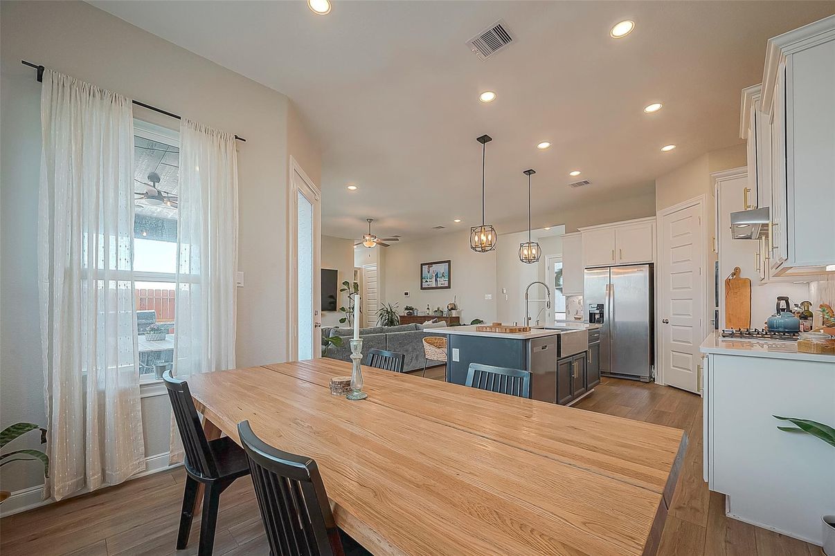 Dining room, Interior, Kitchen, Pendant Lights, Recessed Lighting, Stainless Steel Appliances, Wood Texture Flooring