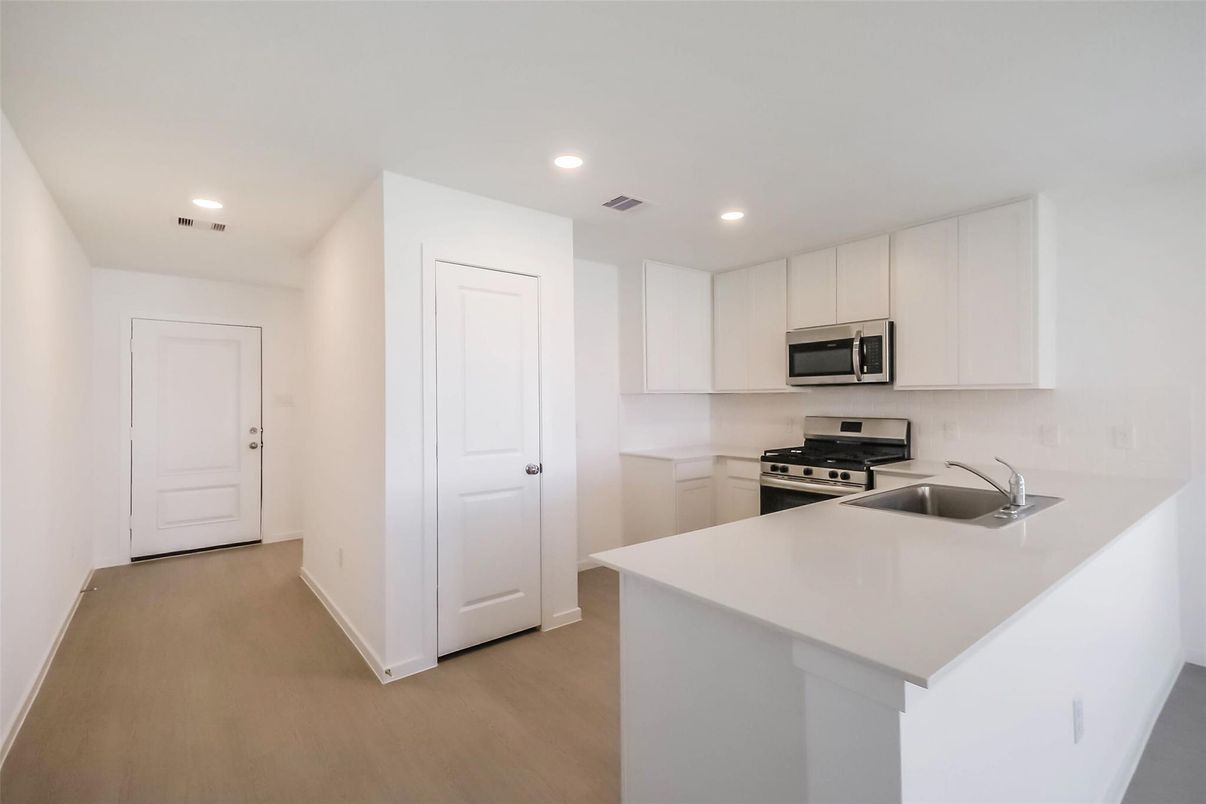 Interior, Kitchen, Recessed Lighting, Stainless Steel Appliances, Wood Texture Flooring