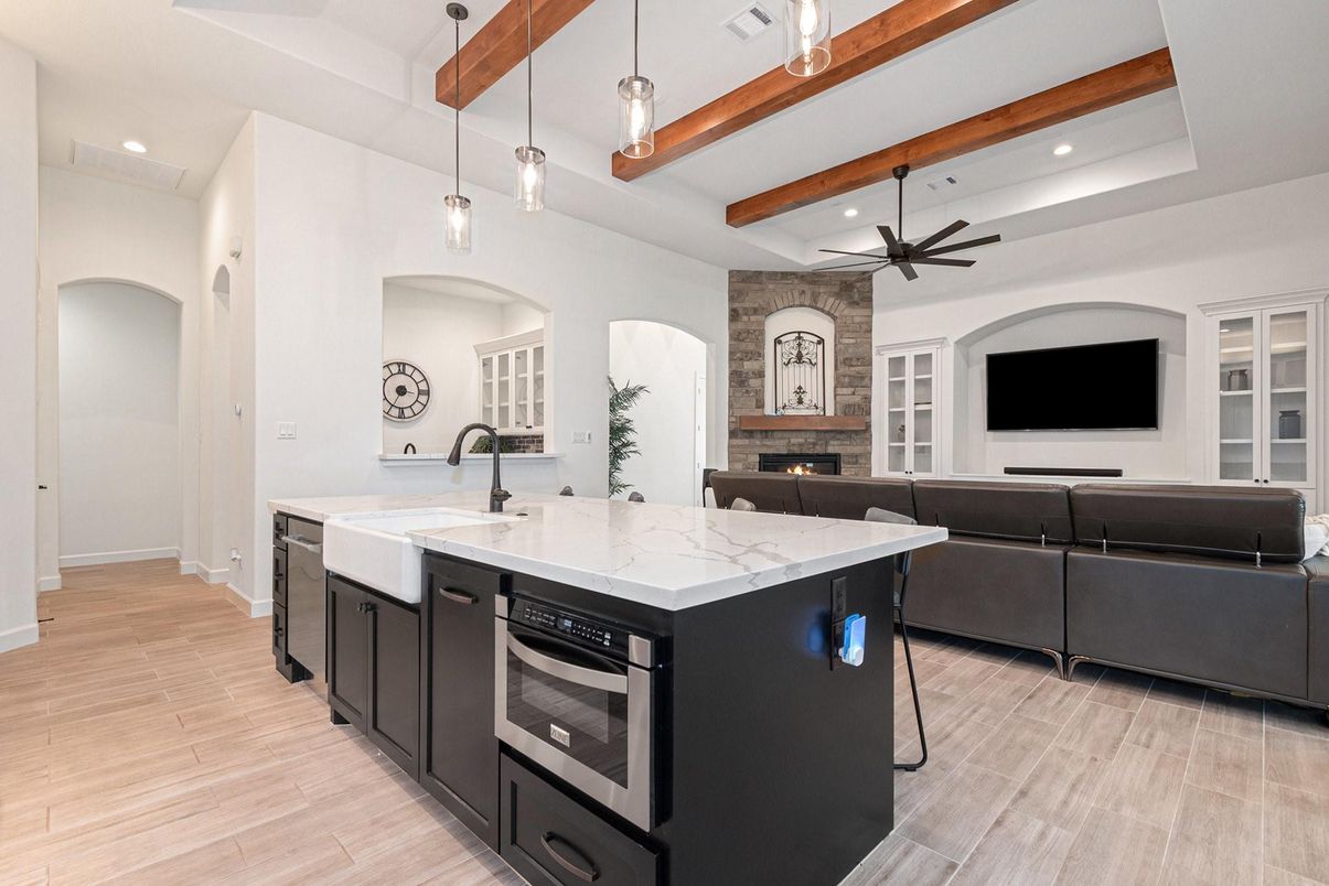 Fireplace, Interior, Kitchen, Living room, Pendant Lights, Recessed Lighting, Stainless Steel Appliances, Stone Walls, Wooden Beams, Wood Texture Flooring