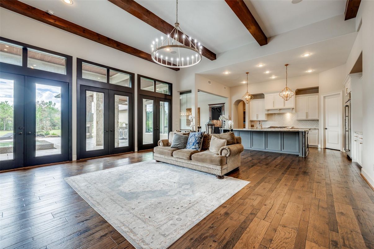 Chandelier, Interior, Kitchen, Living room, Pendant Lights, Recessed Lighting, Stainless Steel Appliances, Wooden Beams, Wood Texture Flooring