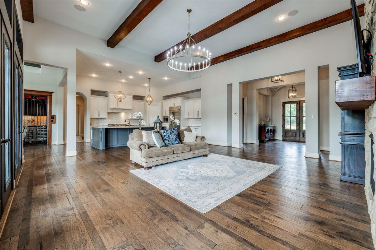 Chandelier, Interior, Kitchen, Living room, Pendant Lights, Recessed Lighting, Stainless Steel Appliances, Wooden Beams, Wood Texture Flooring