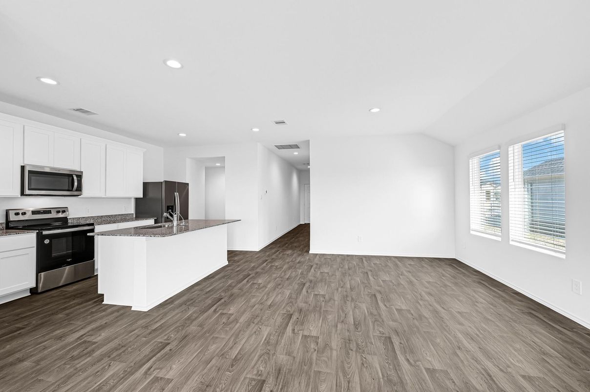 Empty room, Interior, Kitchen, Recessed Lighting, Stainless Steel Appliances, Wood Texture Flooring