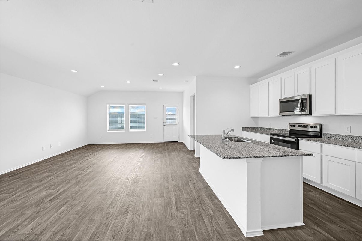 Empty room, Interior, Kitchen, Recessed Lighting, Stainless Steel Appliances, Wood Texture Flooring