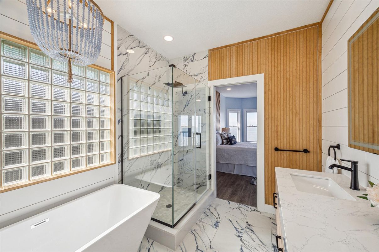 Bathroom, Bedroom, Free Standing Baths, Glass Shower, Interior, Marble, Marble Walls, Recessed Lighting, Wood Texture Flooring