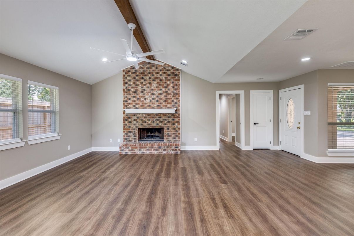 Empty room, Fireplace, Interior, Recessed Lighting, Stone Walls, Wood Texture Flooring
