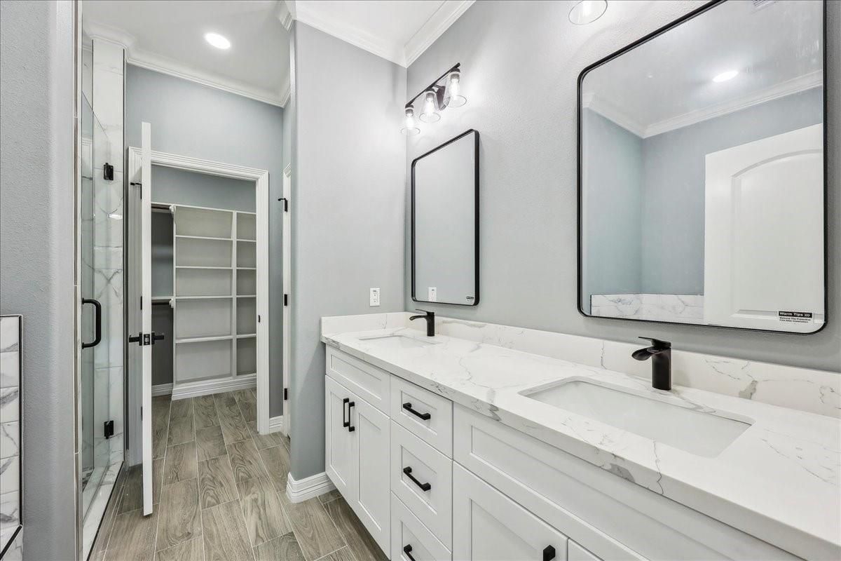 Bathroom, Dual Sink Vanities, Glass Shower, Interior, Recessed Lighting, Walk-in Closets, Wood Texture Flooring