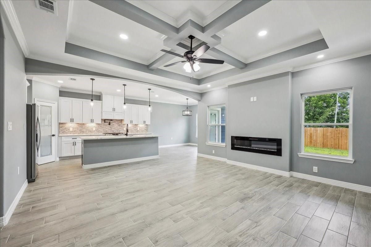 Empty room, Fireplace, Interior, Kitchen, Pendant Lights, Recessed Lighting, Wood Texture Flooring