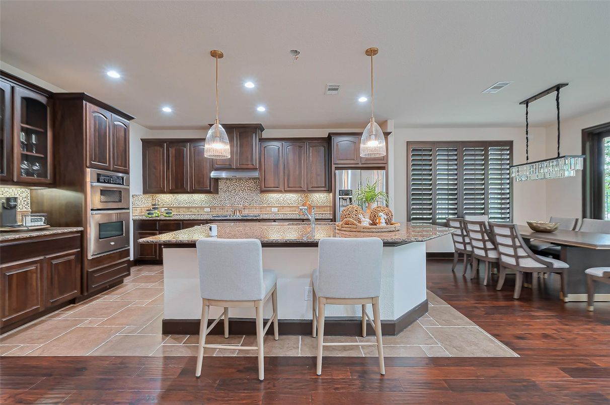 Dining room, Interior, Kitchen, Pendant Lights, Recessed Lighting, Stainless Steel Appliances, Wood Texture Flooring