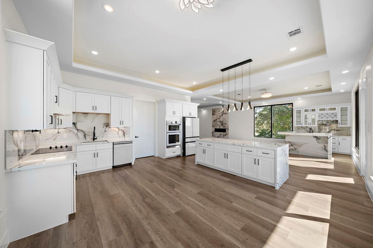 Interior, Kitchen, Marble Walls, Pendant Lights, Recessed Lighting, Stainless Steel Appliances, Wood Texture Flooring
