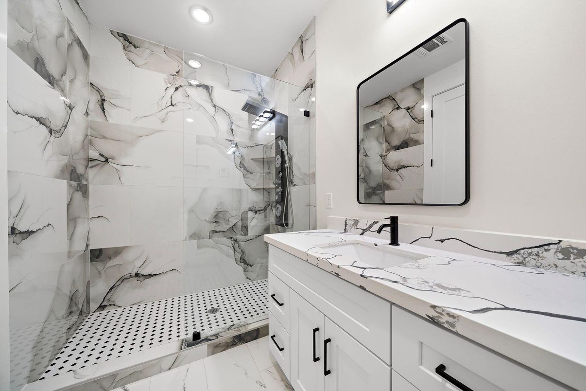 Bathroom, Dual Sink Vanities, Glass Shower, Interior, Marble Walls, Recessed Lighting