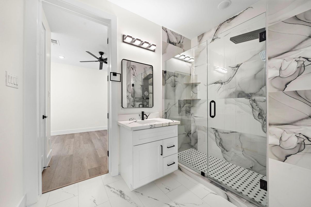 Bathroom, Glass Shower, Interior, Marble, Marble Walls, Recessed Lighting, Wood Texture Flooring
