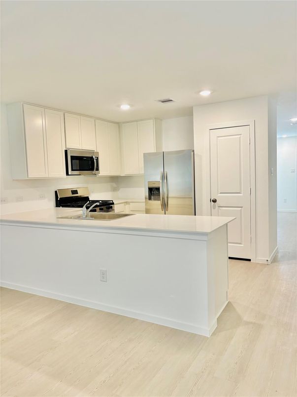 Interior, Kitchen, Recessed Lighting, Stainless Steel Appliances, Wood Texture Flooring