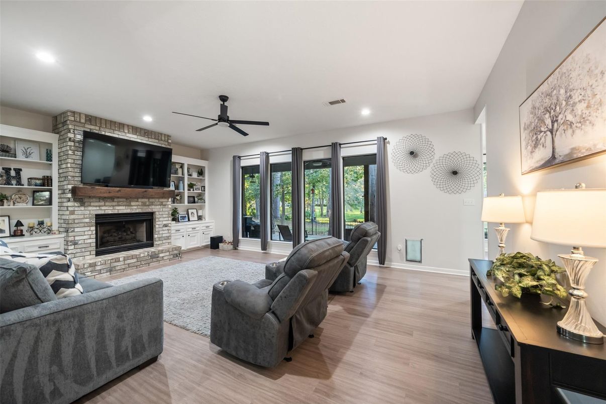 Fireplace, Interior, Living room, Recessed Lighting, Stone Walls, Wood Texture Flooring