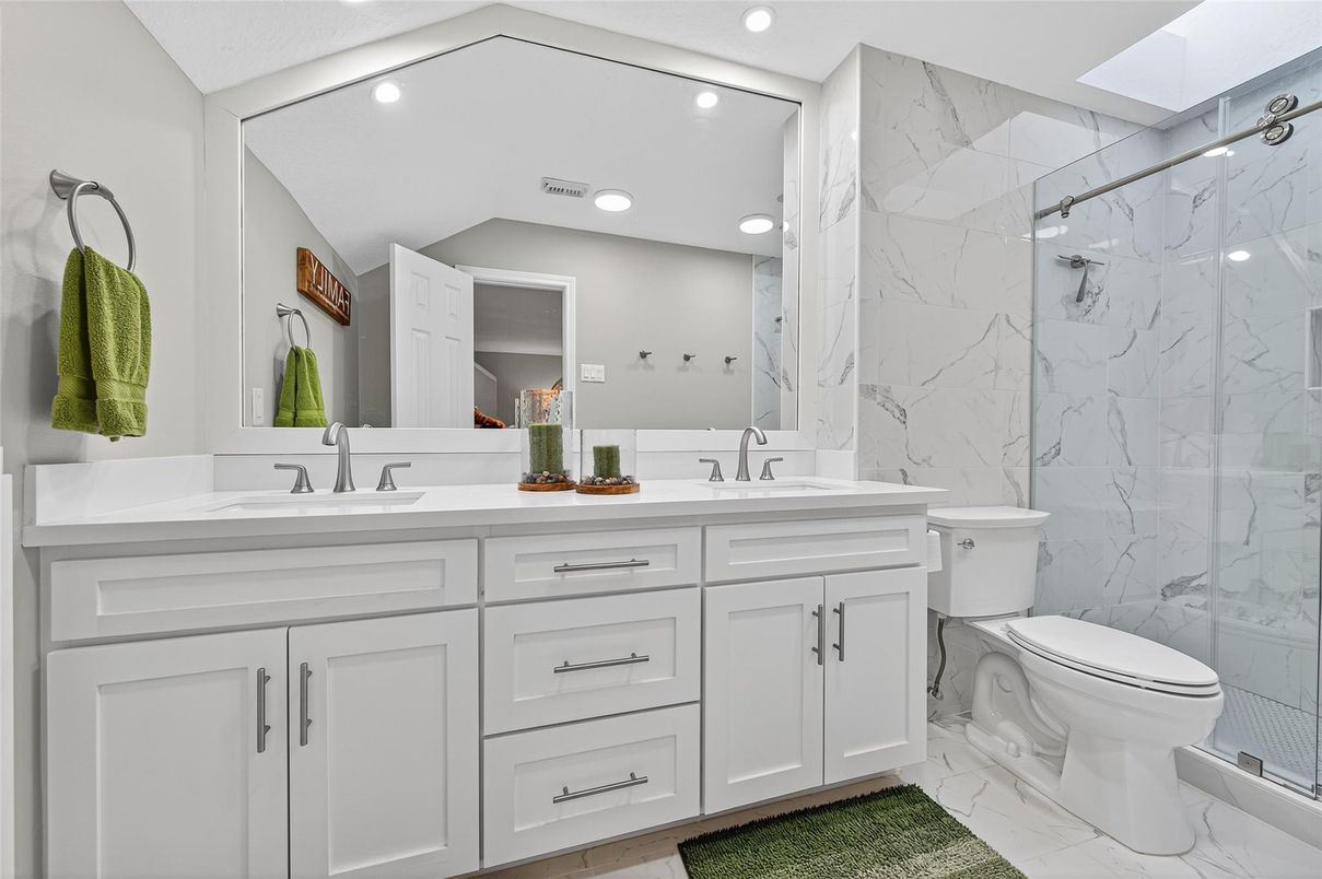 Bathroom, Dual Sink Vanities, Glass Shower, Interior, Marble, Marble Walls, Recessed Lighting