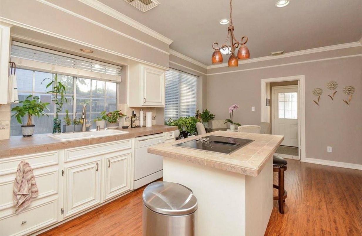 Interior, Kitchen, Recessed Lighting, Tile Countertops, Wood Texture Flooring