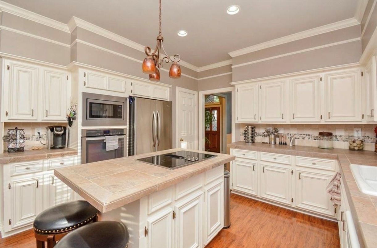 Interior, Kitchen, Pendant Lights, Recessed Lighting, Stainless Steel Appliances, Tile Countertops, Wood Texture Flooring