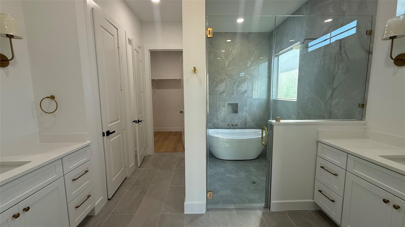 Bathroom, Dual Sink Vanities, Free Standing Baths, Glass Shower, Interior, Marble Walls, Recessed Lighting