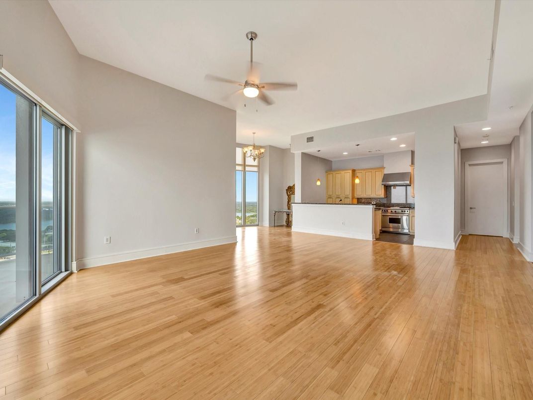 Chandelier, Empty room, Interior, Kitchen, Recessed Lighting, Stainless Steel Appliances, Wood Texture Flooring