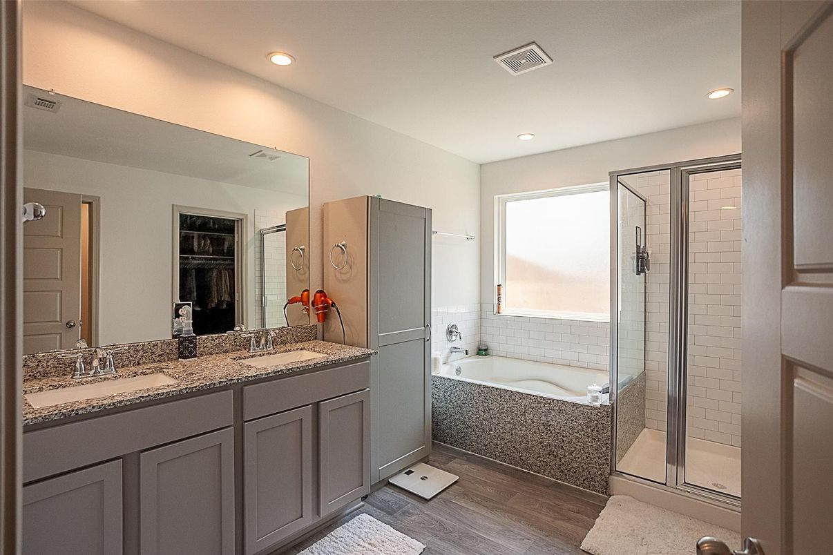 Bathroom, Dual Sink Vanities, Glass Shower, Interior, Recessed Lighting, Wood Texture Flooring
