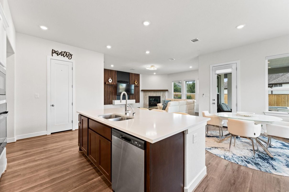 Dining room, Fireplace, Interior, Kitchen, Living room, Recessed Lighting, Stainless Steel Appliances, Wood Texture Flooring