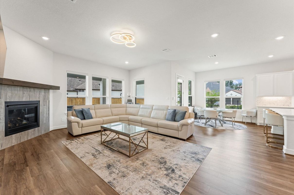 Dining room, Fireplace, Interior, Living room, Recessed Lighting, Wood Texture Flooring