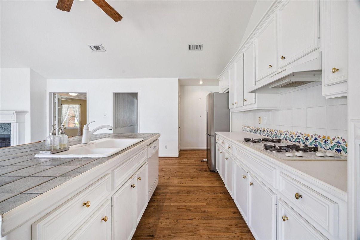 Interior, Kitchen, Recessed Lighting, Tile Countertops, Wood Texture Flooring