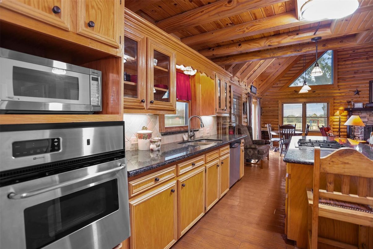 Dining room, Interior, Kitchen, Pendant Lights, Stainless Steel Appliances, Wooden Beams, Wooden Ceilings, Wood Texture Flooring, Wooden Walls