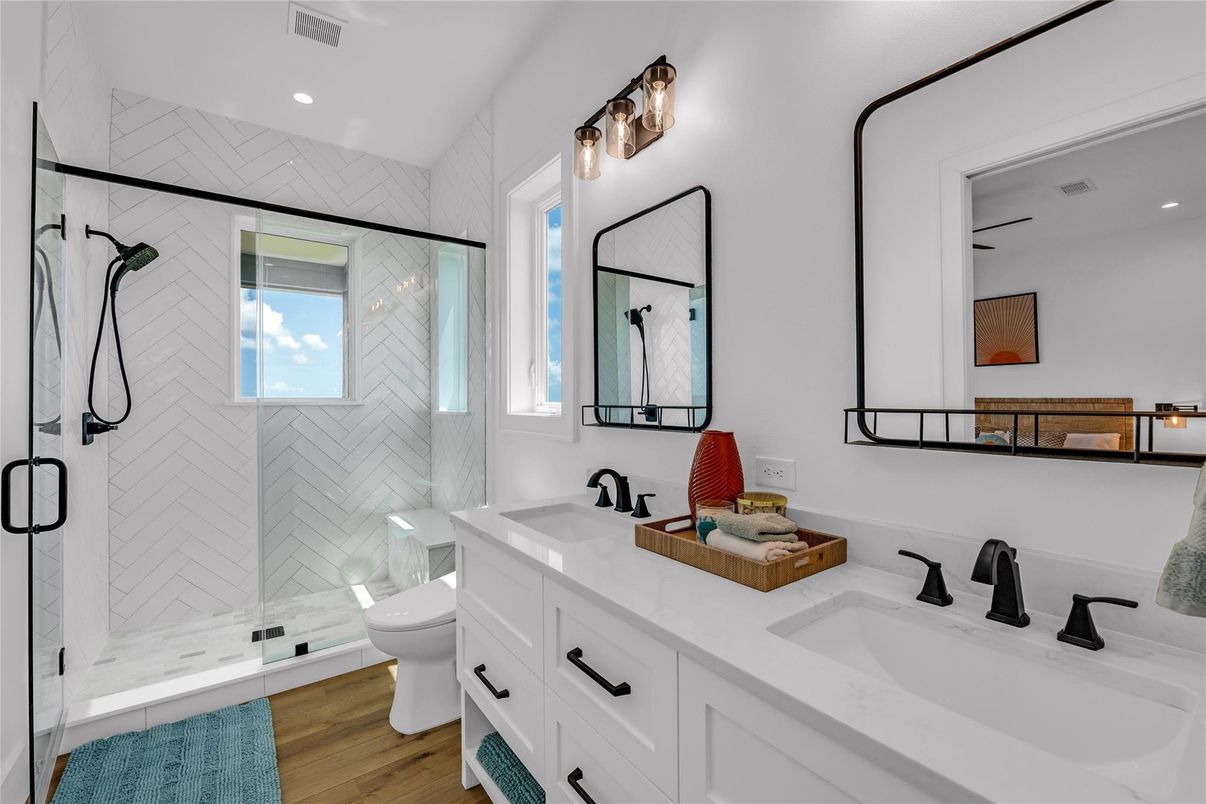 Bathroom, Dual Sink Vanities, Glass Shower, Interior, Recessed Lighting, Wood Texture Flooring