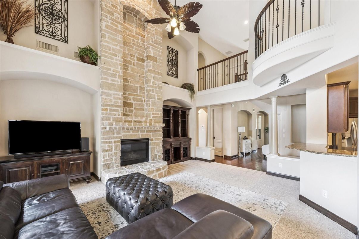 Fireplace, Interior, Living room, Recessed Lighting, Stone Walls, Wood Texture Flooring