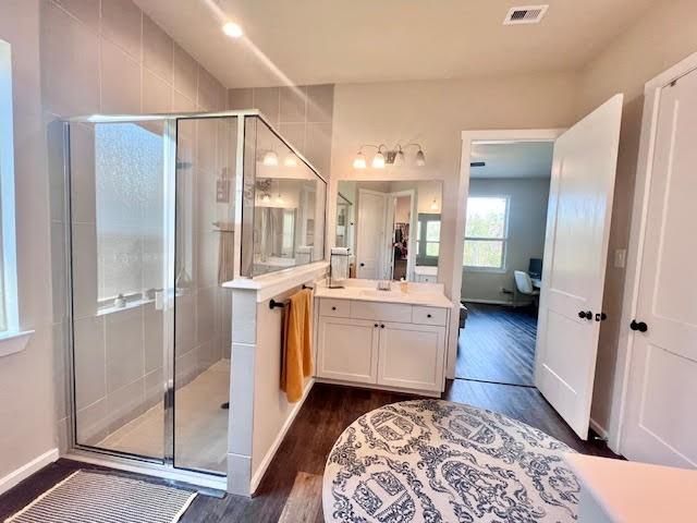 Bathroom, Dual Sink Vanities, Glass Shower, Interior, Recessed Lighting, Wood Texture Flooring