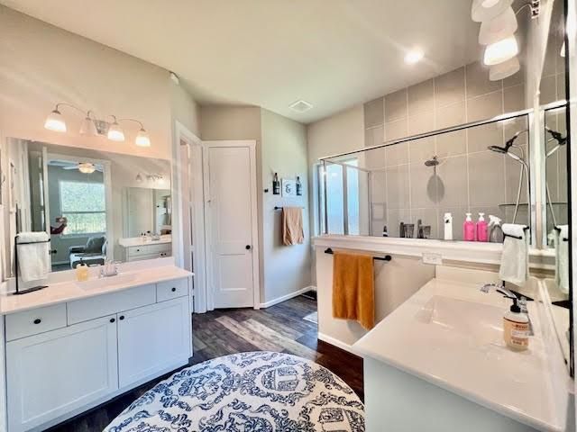 Bathroom, Dual Sink Vanities, Glass Shower, Interior, Recessed Lighting, Wood Texture Flooring