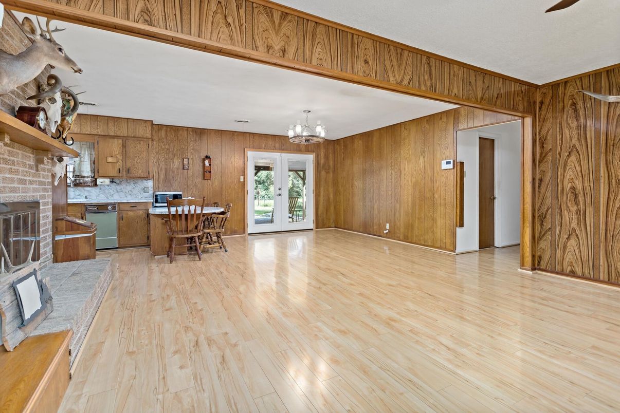 Chandelier, Dining room, Fireplace, Interior, Kitchen, Stone Walls, Wood Texture Flooring, Wooden Walls