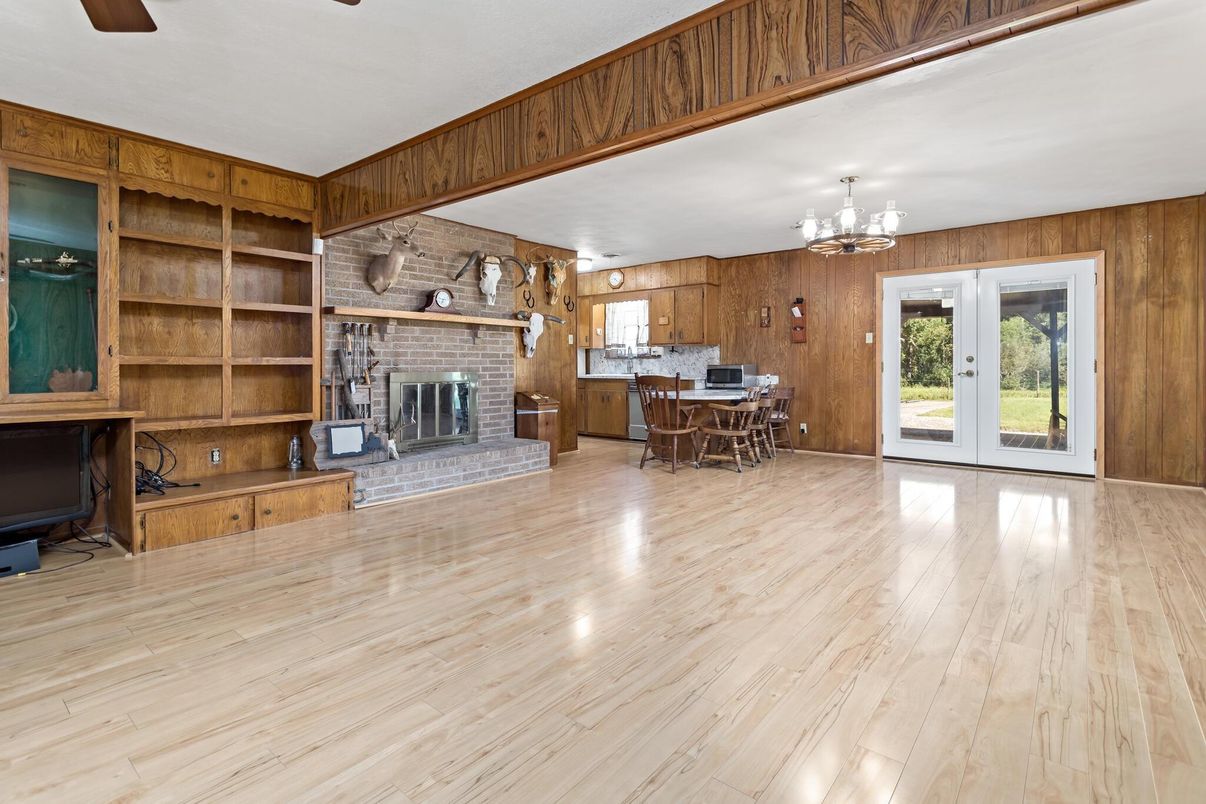 Chandelier, Dining room, Fireplace, Interior, Stone Walls, Wood Texture Flooring, Wooden Walls