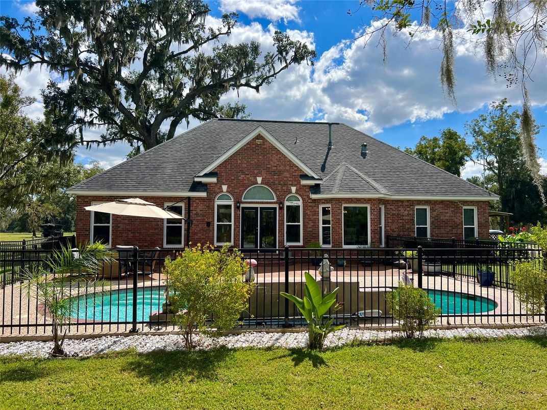 Exterior, Facade, Brick Facade, Pool, Brick Traditional